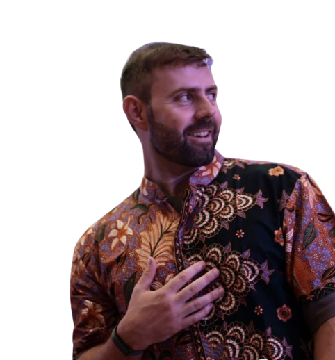 Josh smiling in a patterned shirt
